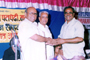 Mr. Eknath Gaikwad, Local MP felicitating Mr. Ashok Sonawane, depositor, in between Mr. Madhusudan Vhatkar, Chairman Sholapur Janata Sahakari Bank Ltd.,

