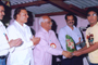 Mr. Maruti Narayankar, Secretary felicitating the boy who obtained good marks in S.S.C. Examination. Present:- from L.to R:- .  Mr. Maloji Honkalas, Director, Mr. Deepak Khandare, Member and Advocate Pradip R. Kadam, Chairman.